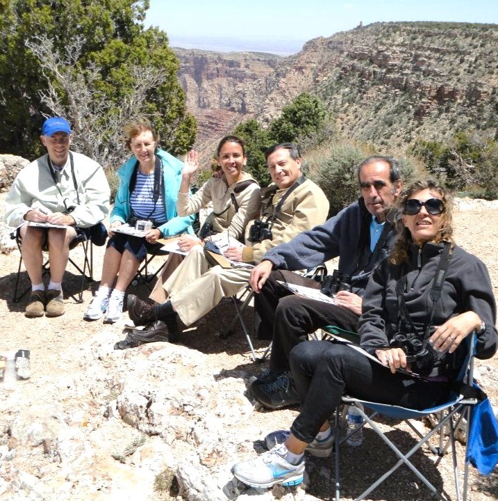 Happy guests studying rocks of the canyon.