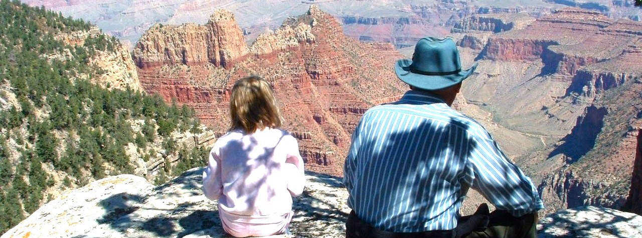 Guests relaxing at a Grand Canyon viewpoint on a private tour